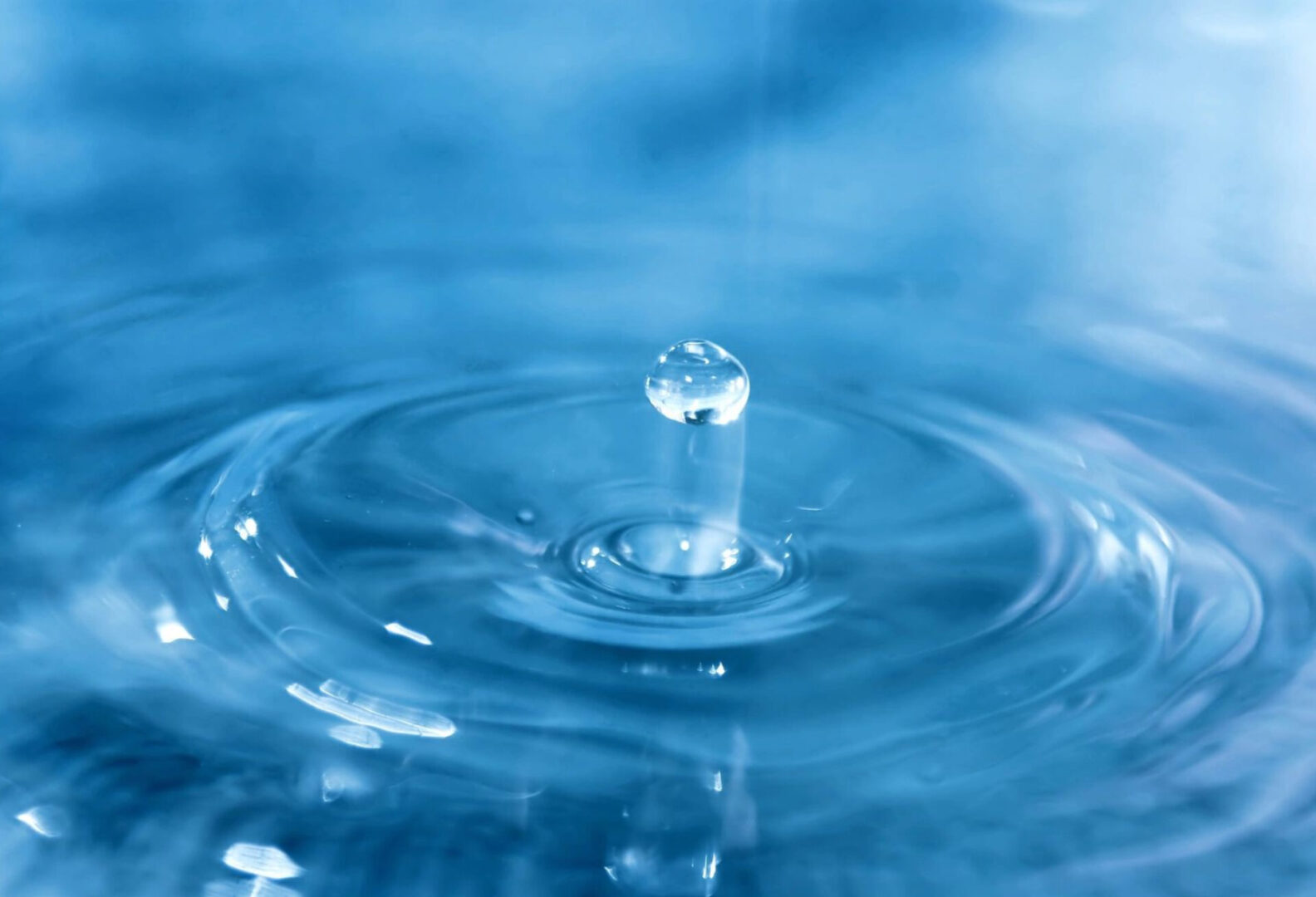 Closeup of a water drop falling down