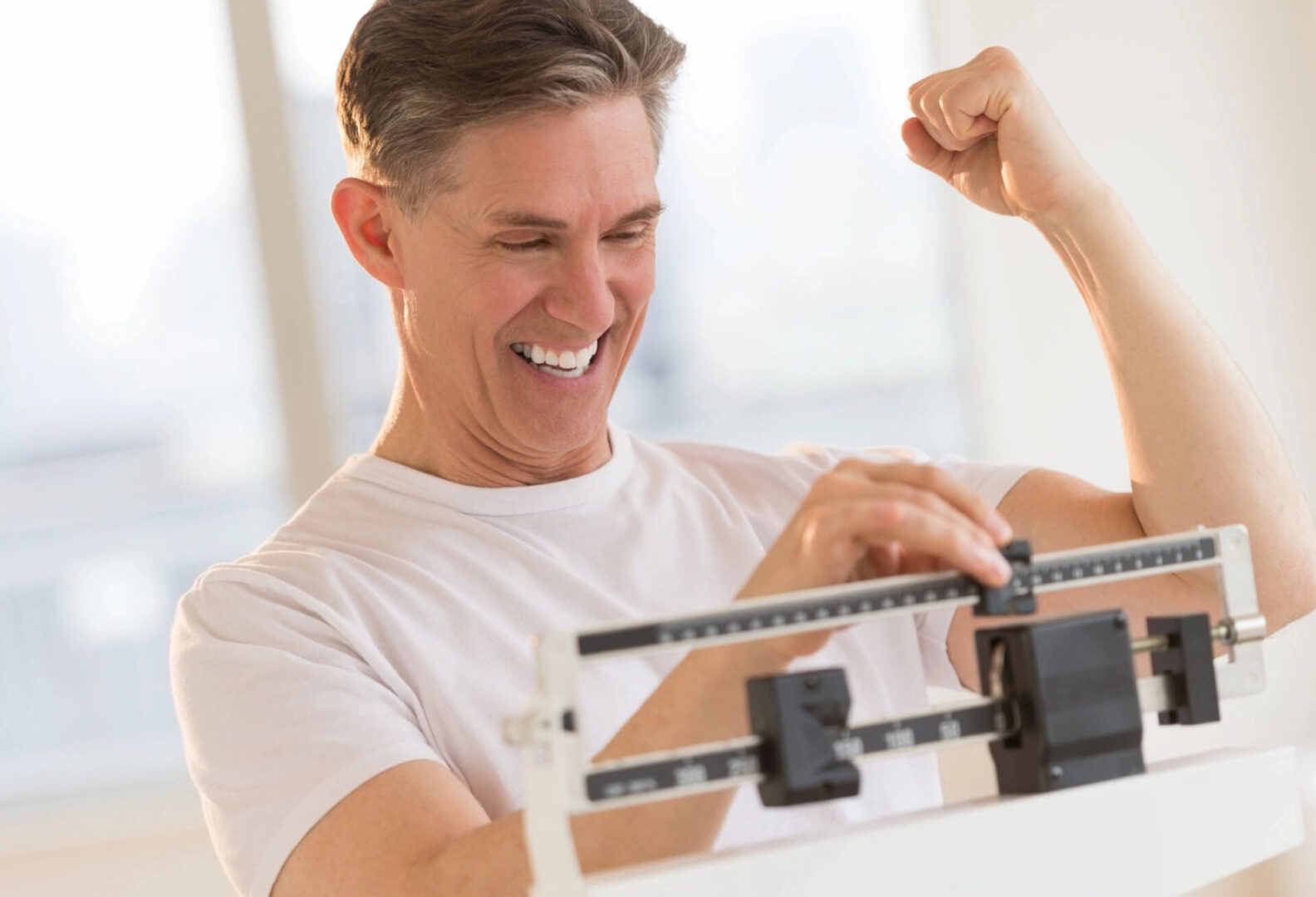 a happy man measuring the size with a tool